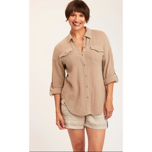tan colored long roll up sleeve button down collared shirt with front breast pockets front view