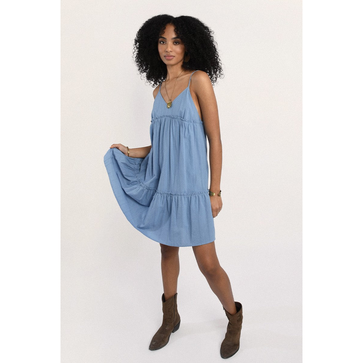 Full body view of the Mini Babydoll Dress showing the light denim color and length.