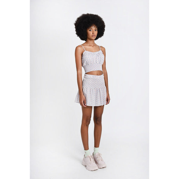 A full body picture showing the Off White Martine Bustier Top paired with a skirt and sneakers showing one of the styling options