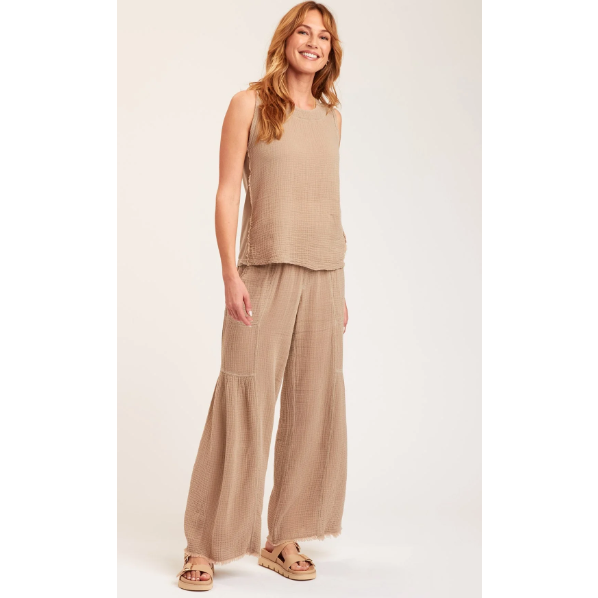 wide flare pant in latte color with unfinished hemline paired with a matching sleeveless tunic top