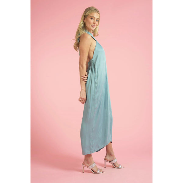 side view showing the sky blue color and flowy aspect of the jumpsuit