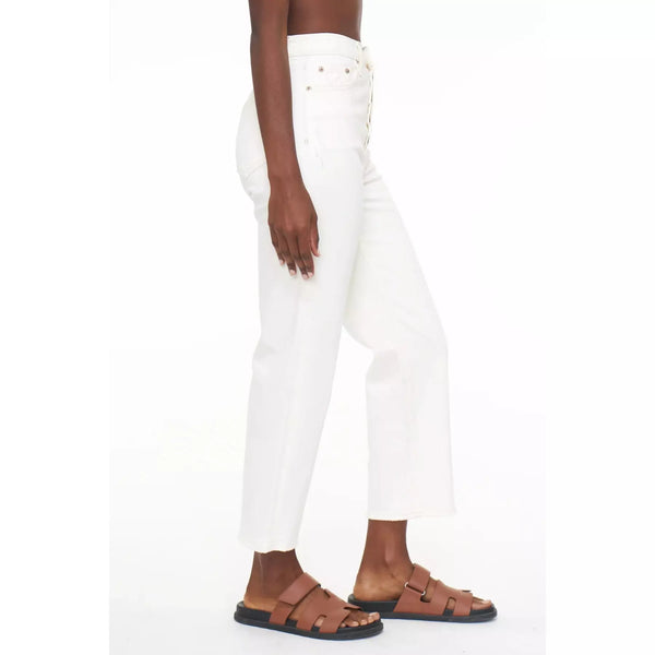 side view showing the cropped aspect of the jeans at the ankle