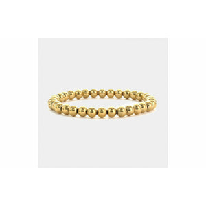 Gold Tone Stretch Bracelet With Big and Small Alternating Beads