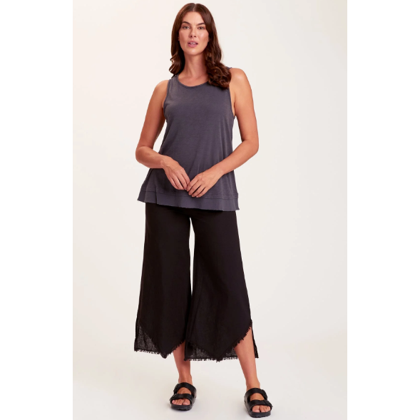 Astri Pant shown in Black with stretchy waist, wide leg, and flared bottom.