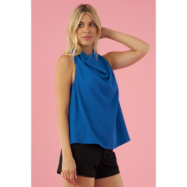 Front view of  the Drape Neck Blouse showing a rich royal blue and loose, flowy material