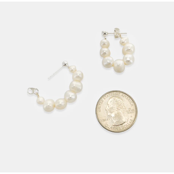 freshwater pearl hoop earring flat lay view with quarter for comparison size