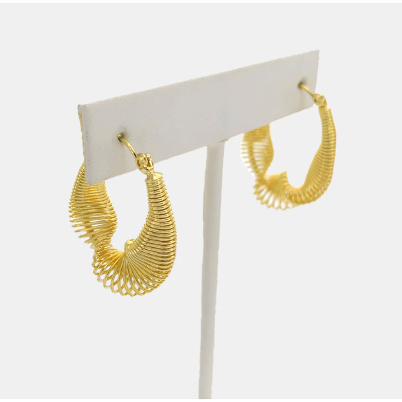 front angled view of twisty slinky gold hoop earring