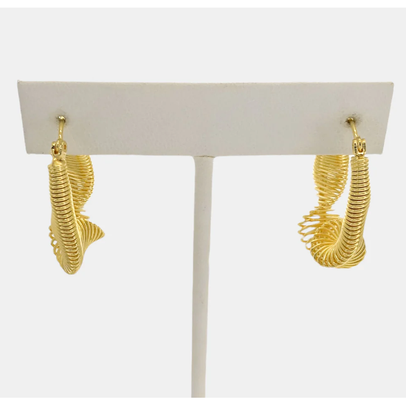 front view of slinky hoop gold earring on an earring stand