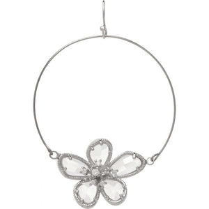showing the silver hoop that has a large, clear flower charm