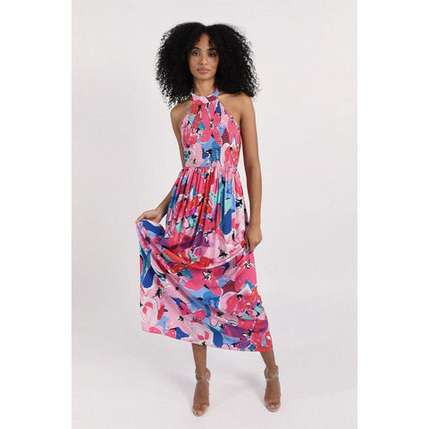 Vibrant Floral Maxi Dress w/ model holding the skirt front view